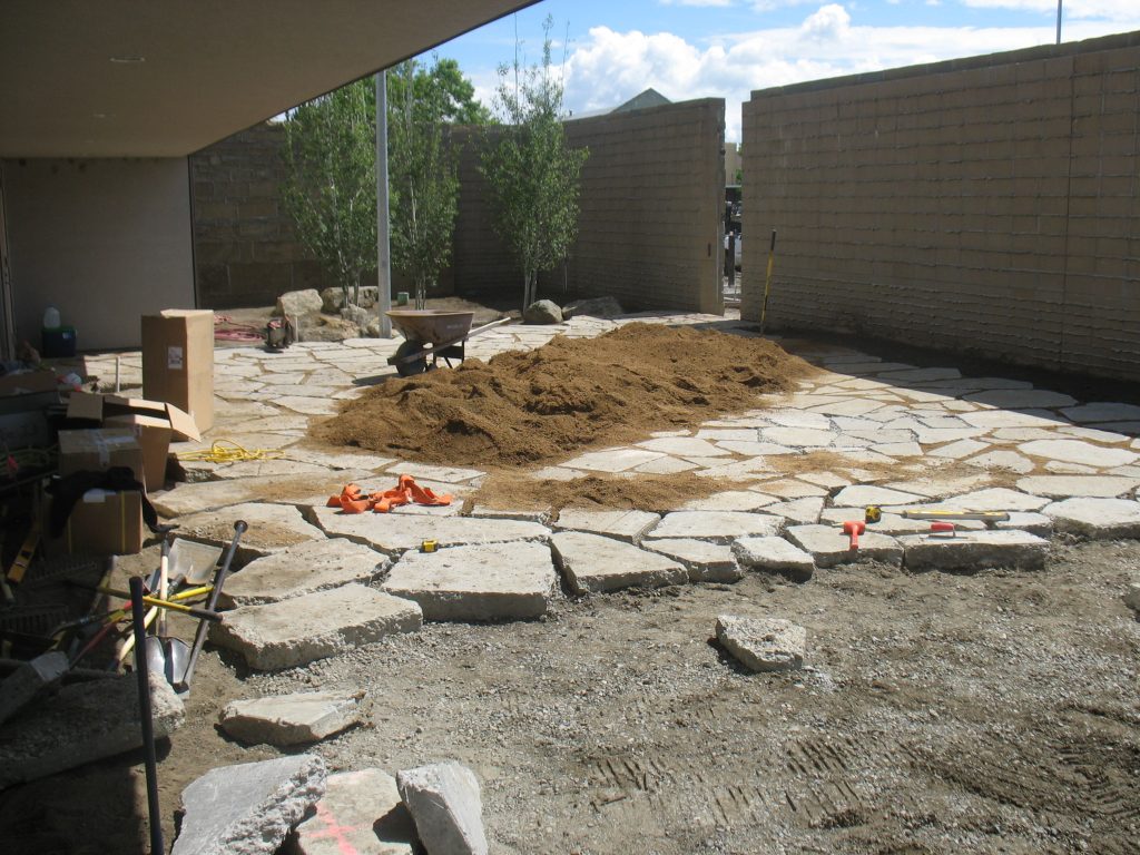 The enclosed patio off the library’s community interior space was done in recycled concrete that was set in a sand bed. PHOTO: River Ridge Landscape Co.