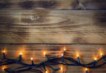Holiday Twinkle Lights Against Wood