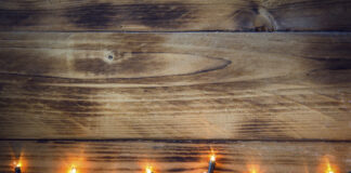 Holiday Twinkle Lights Against Wood