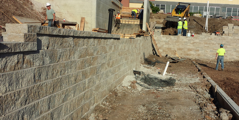 in progress soccer stadium retaining wall