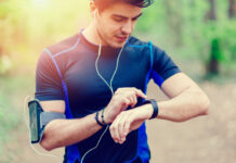 man running with smart watch