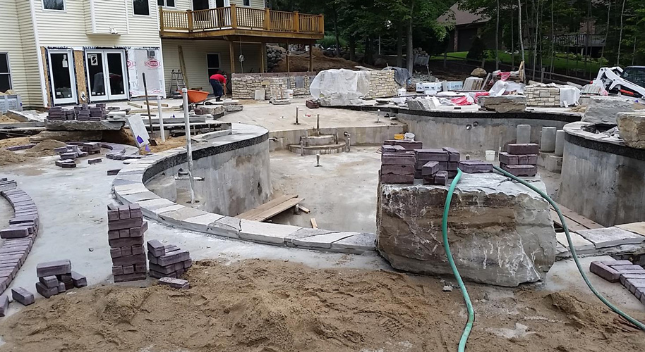 Installing the pool Photo: Landscape Design Services, Inc.